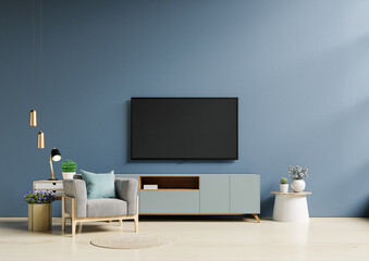 TV in modern living room with armchair have empty dark blue wall background.