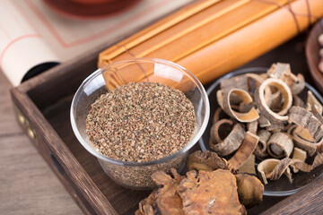 Chinese medicine Cnidium monnieri and bamboo slips books in the medicine box