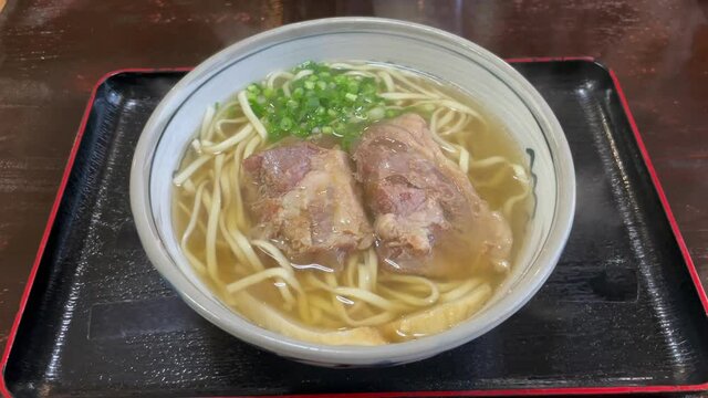 OKINAWA, JAPAN : Okinawa traditional food &ldquo;Soki soba (Noodle soup with pork ribs)&rdquo;.
