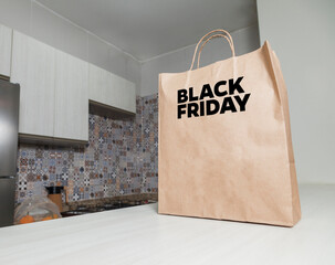 Black Friday cardboard bag on the table brown paper packaging with personalized writing and kitchen...