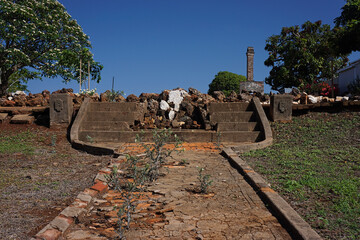 An old weedy path and steps leading to a house long since demolished with only the chimney remaining in Ravenswood, Queensland, Australia. - obrazy, fototapety, plakaty