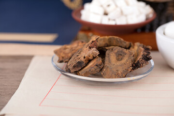 A plate of Chinese medicine rhubarb on prescription paper