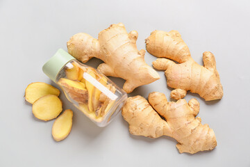 Composition with fresh ginger on grey background