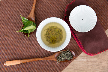 Gaiwan tea and tea leaves on tea mat