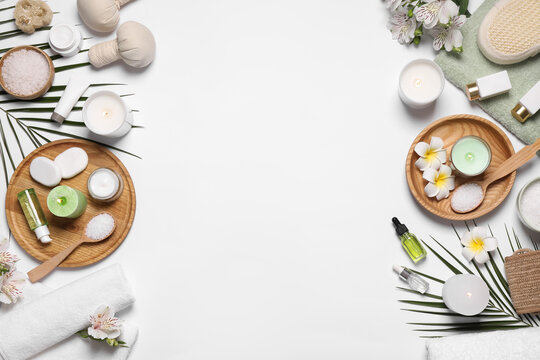 Flat lay composition with spa essentials on white background. Space for text