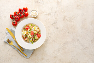 Plate with tasty Caesar salad and sauce on color background