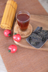 A cup of tea and tea and food and others on a cutting board