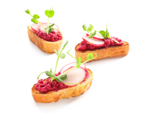 Tasty bruschettas with radish on white background