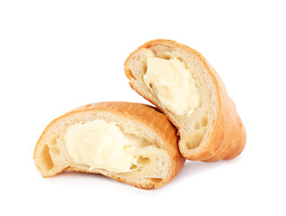 Halves of delicious croissant with cream on white background