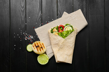 Composition with tasty doner kebab on dark wooden background