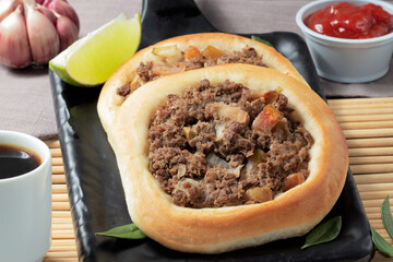 Delicious meat esfiha and coffee.