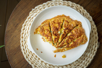 Malaysian omelete or telur dadar served on the table.