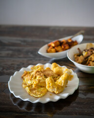Assorted Malay dishes served on the table. Staple menu for lunch and dinner in Malaysia.