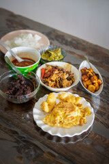 Assorted Malay dishes served on the table. Staple menu for lunch and dinner in Malaysia.