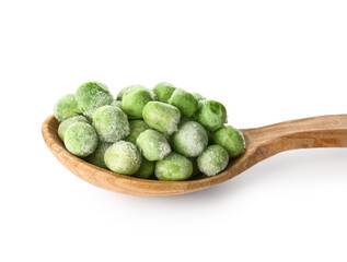 Spoon with frozen green peas on white background