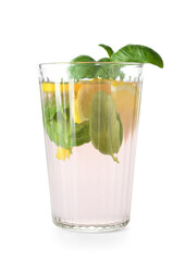 Glass of tasty lemonade with basil on white background