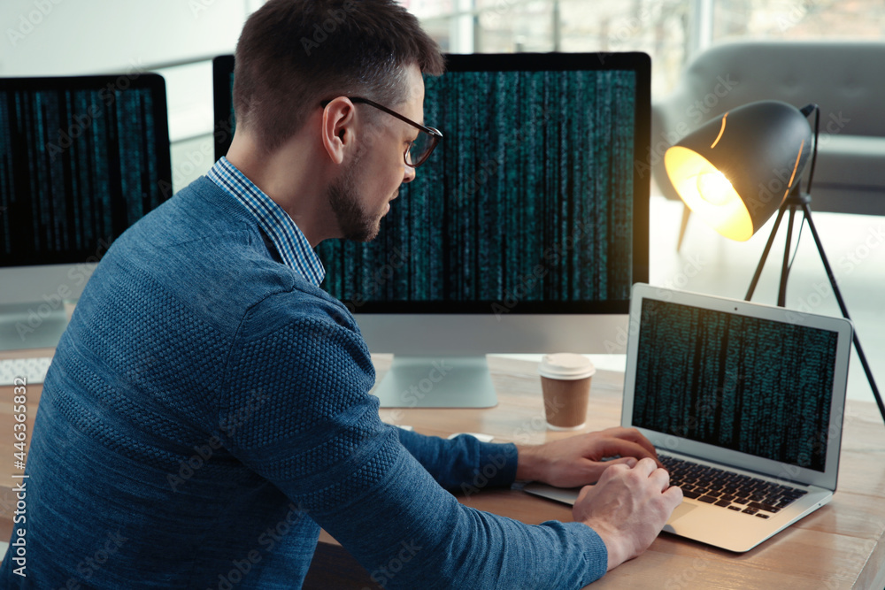 Aufkleber programmer working at desk in modern office