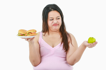 Isolated studio shot of Asian concentrate stress big fat overweight girl hate and does not like...