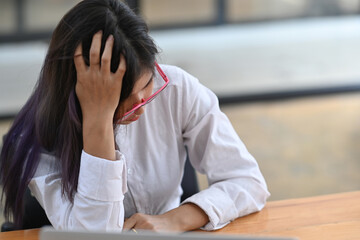 Young Asian woman feeling tired and bored with depression problems.