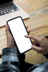 Close up view woman holding mobile phone with empty display.