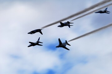 Japan Air Self Defense Force aerobatic team Blue Impulse flying in deep blue sky