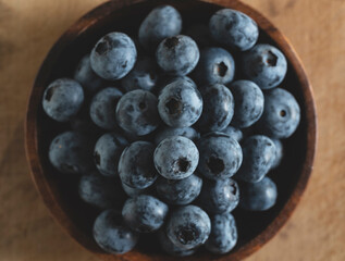 Blueberries on an old wooden table.