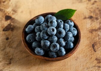 Blueberries on an old wooden table.