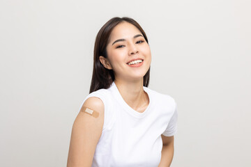 Vaccination. Young beautiful asian woman getting a vaccine protection the coronavirus. Smiling...