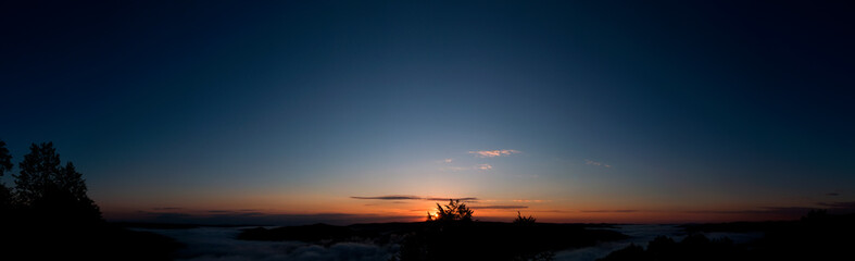 bright sunrise in the mountains with blue sky