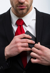 Young businessman with phone, red tie in a suit and west, business.