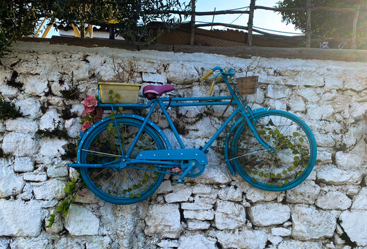 old blue bicycle in the street