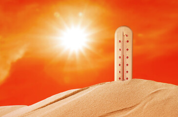 Weather thermometer with high temperature outdoors on hot sunny day. Heat stroke warning