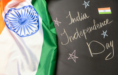 Text INDIA INDEPENDENCE DAY and flags on dark background