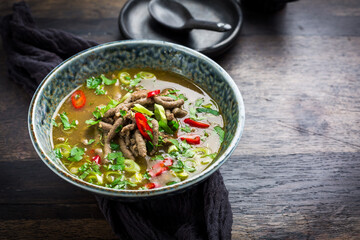 German liver dumpling soup with onion and vegetable