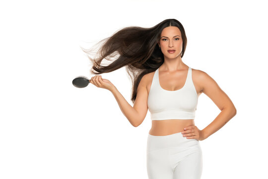 A Young Beautiful Woman Brushes Her Flying Long Hai