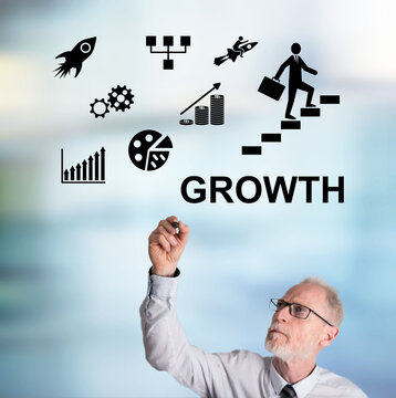 Businessman drawing growth concept