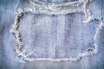 Light blue denim frame texture with  torn patterns abstract for background and space