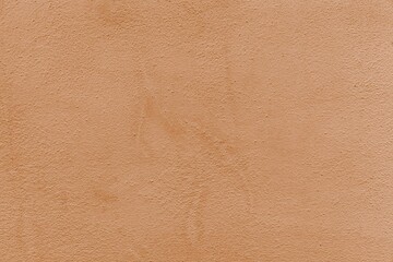 The cement wall is painted brown with a pattern texture and background seamless