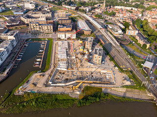 Luxury apartment complex construction at riverbank of river IJssel between train station and recreational port. Aerial panorama blueprint view of the new Kade Zuid residential urban housing project