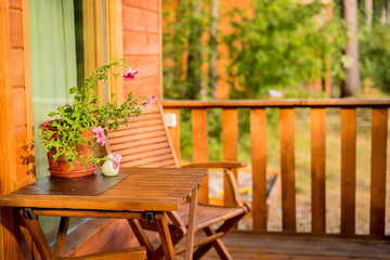 Terrace with table and chairs and garland of lights