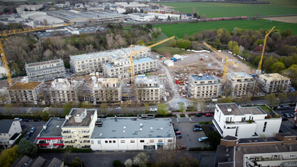 Fototapeta premium An aerial view of a large construction site where a new neighborhood of residential buildings is being built in West Germany