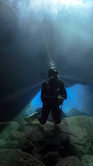 Fototapeta premium Scuba diver in glacier cave