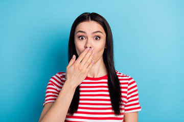 Photo of shocked amazed surprised woman cover close mouth with hand feel guilty isolated on blue...