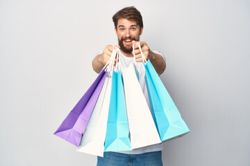 man with packages in his hands fashion shopping discounts emotions