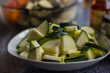 fresh cut vegetables in a plate while cooking healthy food