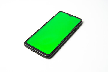 Smartphone mockup with green screen inside, isolated on white background