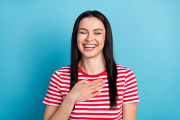 Photo of young girl happy positive smile hand on chest humor joke laugh isolated over blue color...
