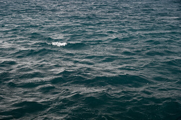 Sea Waves at stormy weather. Disturbed water surface. Ocean waves at windy day.