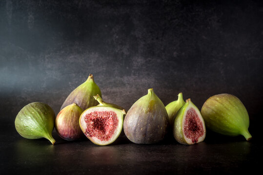 Ripe figs placed on wooden table