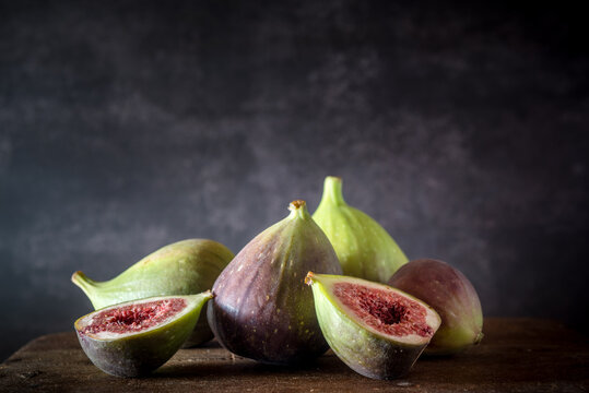 Ripe figs placed on wooden table